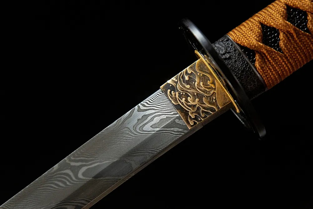 Upper blade closeup oil quenched folding steel near solid copper habaki