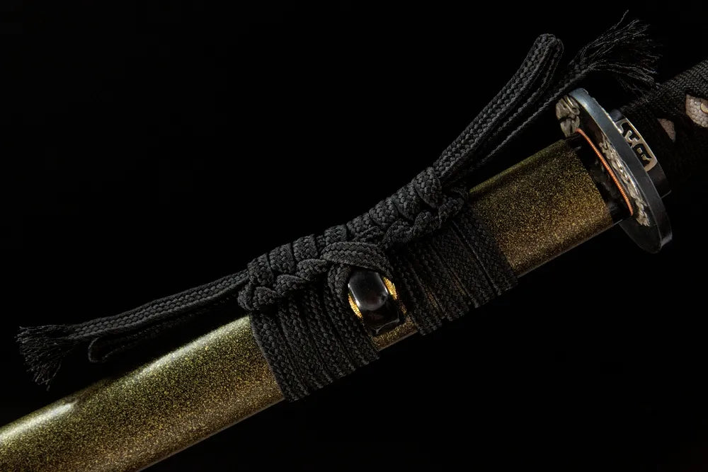 Coarse cotton sageo cord tied on Qiuniu katana saya ring