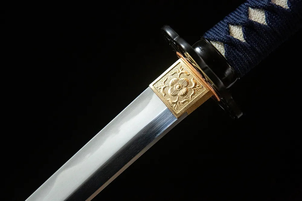 Upper blade closeup Hummingbird Wakizashi, gonome hamon near copper habaki carved blade ornament