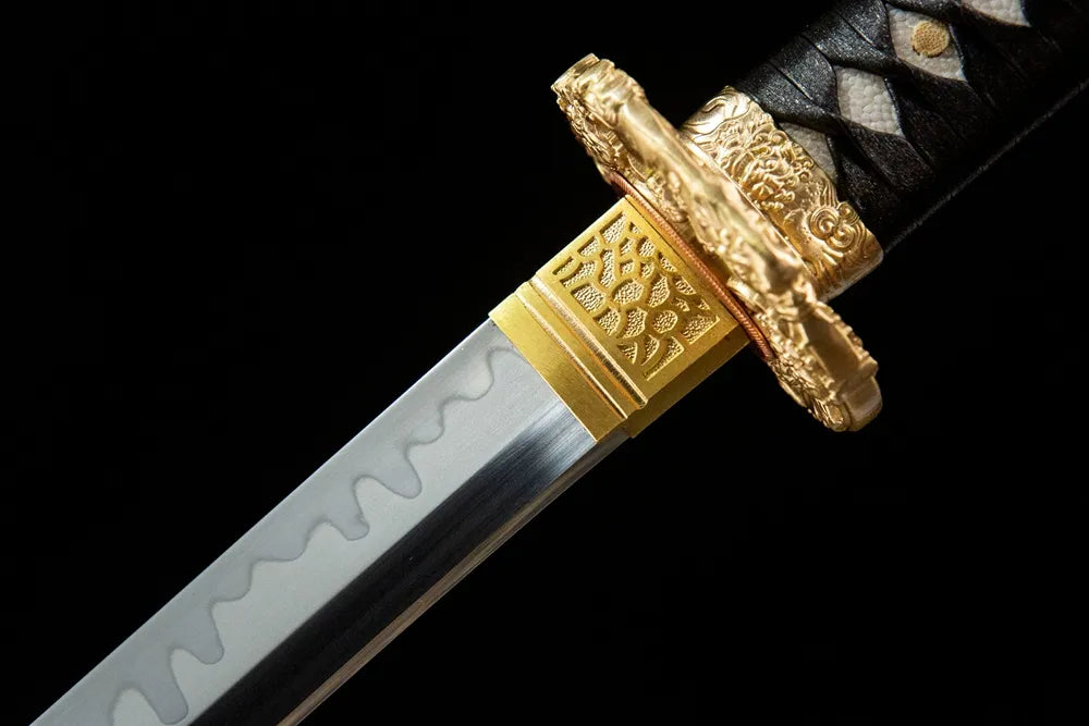 Upper blade closeup The Firmament Tachi, clear gunome hamon near solid copper habaki real yokote line
