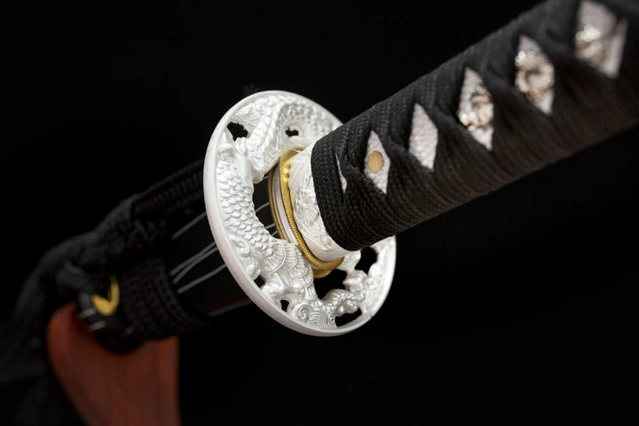 The tsuba is made of zinc alloy and engraved with a Chinese dragon in silver plating