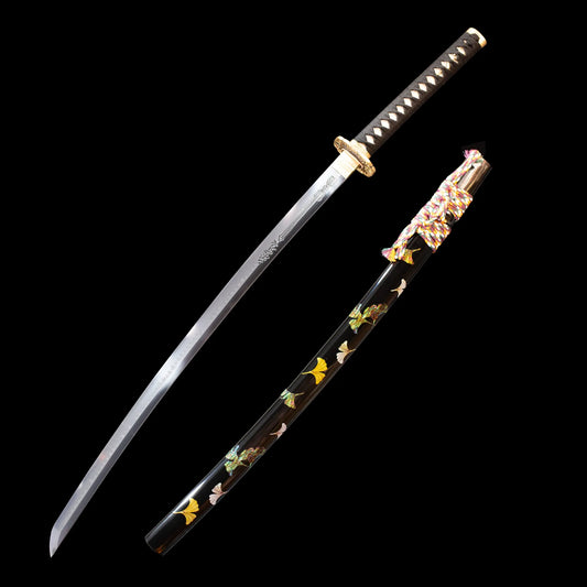 Black katana with flowers painted on it