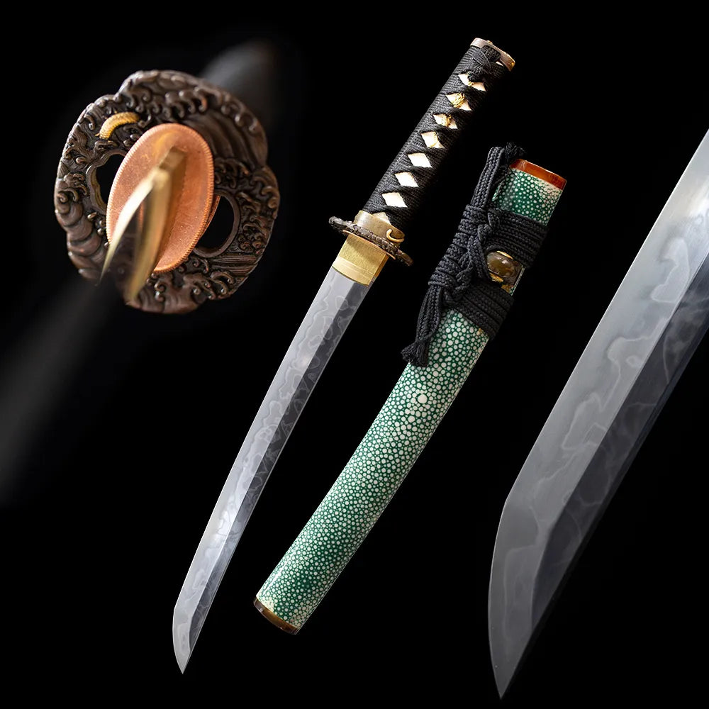 Green‑Demon‑Wakizashi japanese oni green‑demon dark‑fantasy wakizashi short samurai sword drawn T10 notare flowing hamon blade dark‑green oni‑etched saya full black‑background studio shot