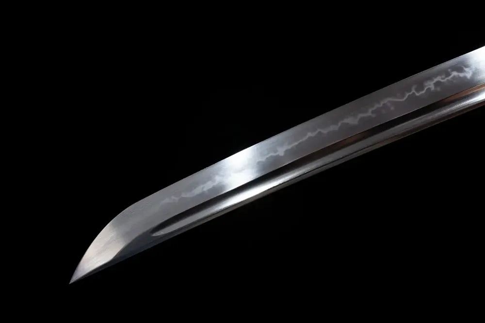 Compact wakizashi‑style pointed kissaki tip of Mirror‑Heart‑Demon‑Wakizashi blade close‑up view‑short wakizashi