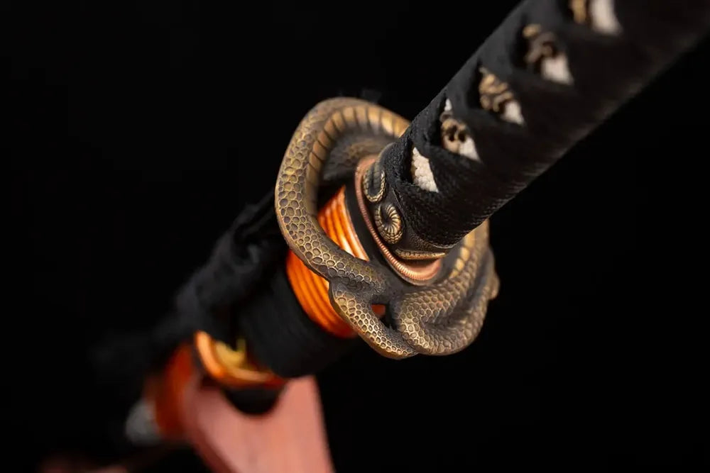 Reverse‑side winding‑serpent‑scroll carving antique‑copper tsuba surface texture close‑up