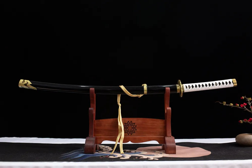 Horizontal laid closed matte dark‑grey Yamato scabbard game replica katana
