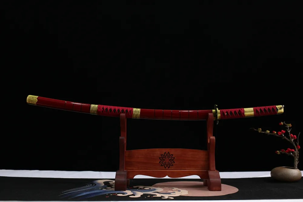 Horizontal laid closed bright‑red lacquer Sandai Kitetsu scabbard flat display