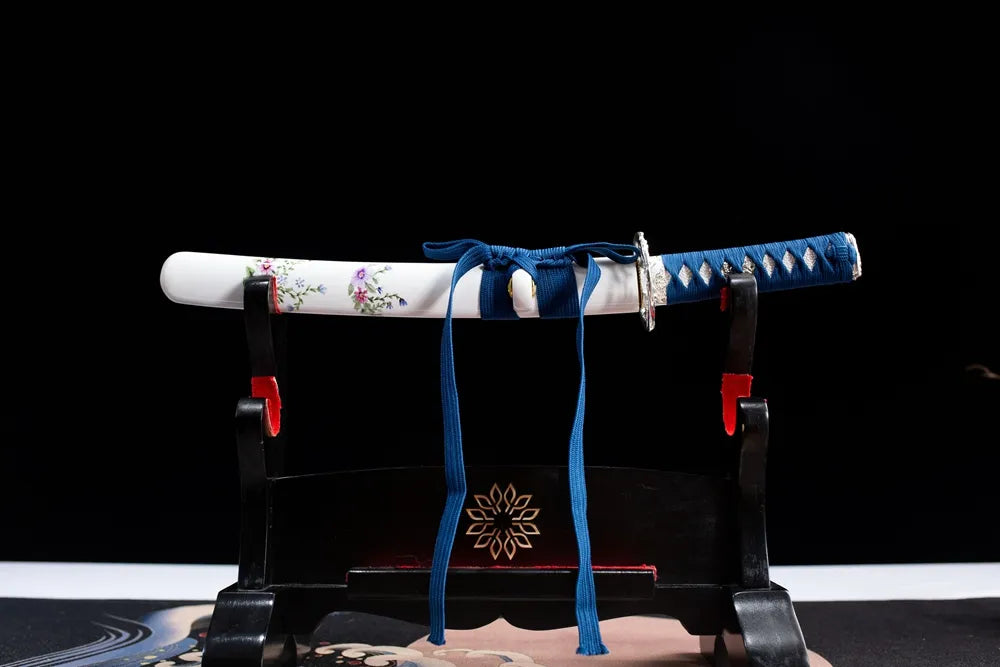 Horizontal laid closed pastel flower mini samurai side sword