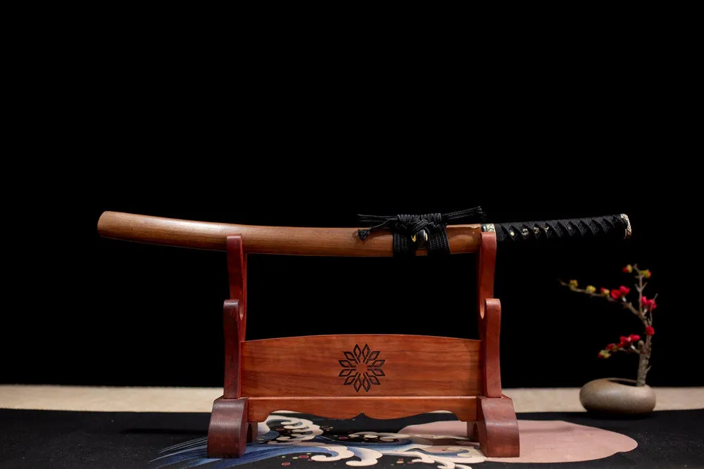 Horizontal laid closed matte‑brown practical Counterblade‑Katana scabbard flat table‑top front display