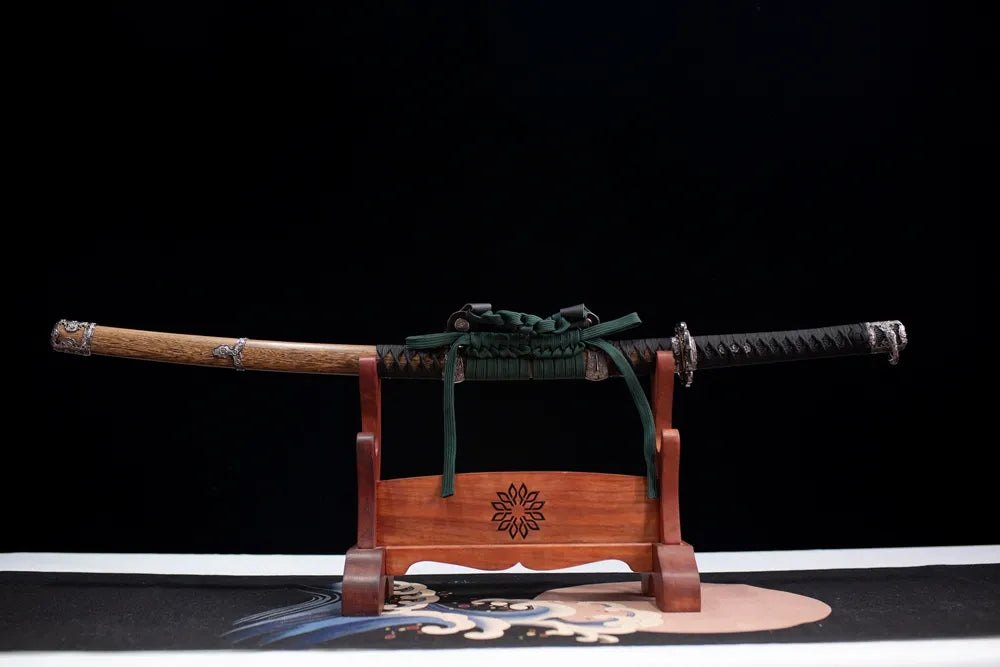 Horizontal laid closed vintage wood‑grain Night‑Eagle‑Tachi scabbard flat table‑top front display