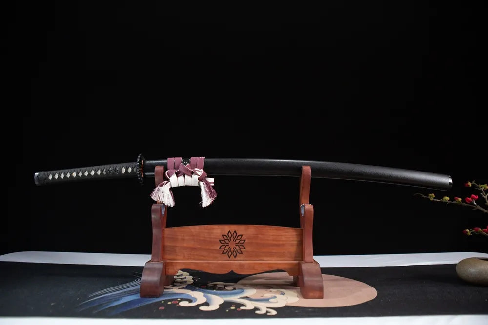 Horizontal laid closed all-black yakuza samurai sword