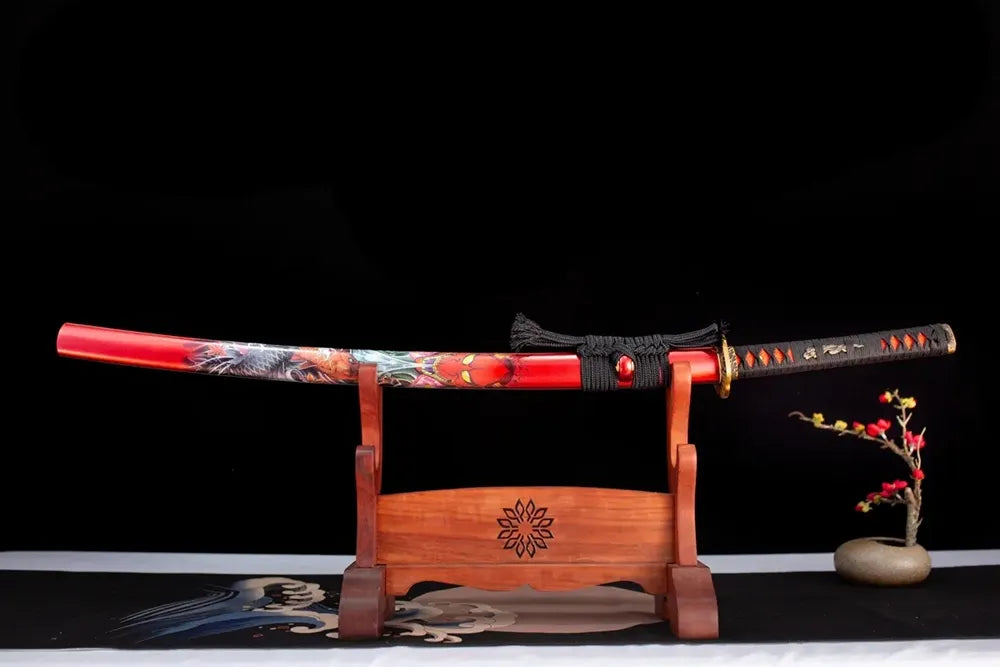 Horizontal laid closed fiery‑red hannya‑demon‑koi‑carp Prajna‑Katana scabbard flat table‑top front display