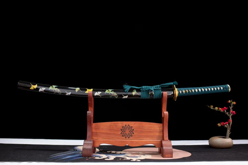 Horizontal laid closed ink‑blot finish Ink‑Style‑Katana scabbard flat table‑top front display