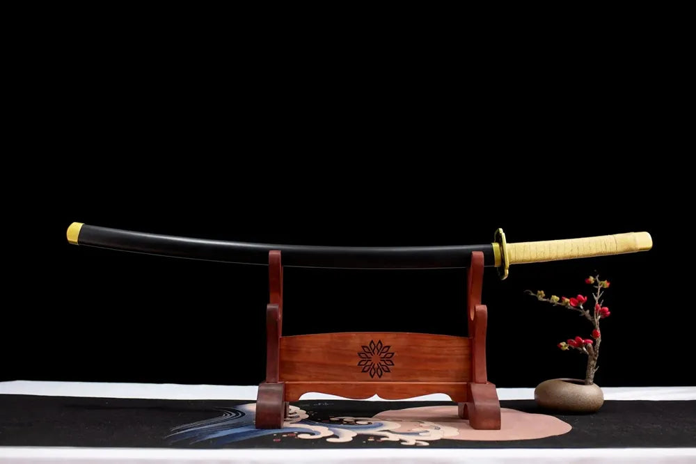 Horizontal laid closed black baking‑paint Yoriichi scabbard flat table‑top front display