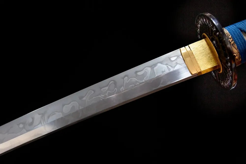 Upper T10 clay‑tempered katana blade brass habaki choji‑midare butterfly‑wing‑vein layered‑dancing hamon temper‑line macro close‑up
