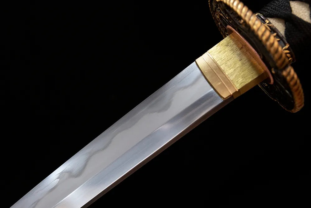 Upper sanmai damascus‑clad‑T10 clay‑tempered wakizashi blade copper habaki gunomu wavy hamon temper‑line macro close‑up