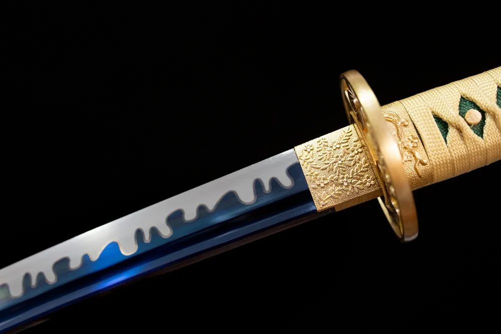 Upper high‑carbon‑steel blue‑tempered katana blade brass habaki suguha‑gunome plum‑snow‑falling undulating hamon temper‑line macro close‑up
