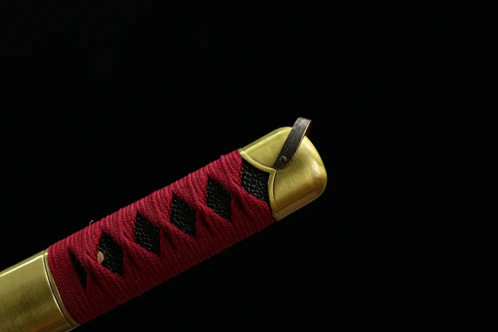 Top alloy embossed kashira pommel front close‑up