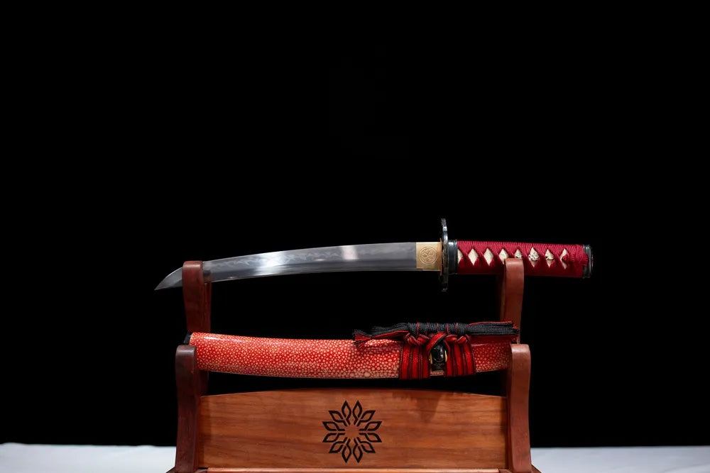 Flat fully‑drawn T10 clay‑tempered suguha‑hamon Red‑Plum‑Wakizashi blade wooden rack front shot