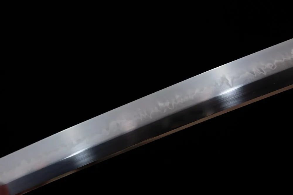 Mid‑section splash‑pattern cherry‑petal‑scatter‑pattern hamon steel katana blade surface close‑up shot