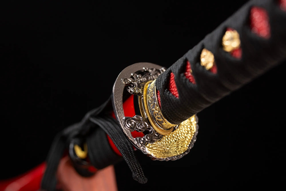 Reverse‑side amphibian‑salamander‑scroll carving gilded‑alloy tsuba surface texture close‑up