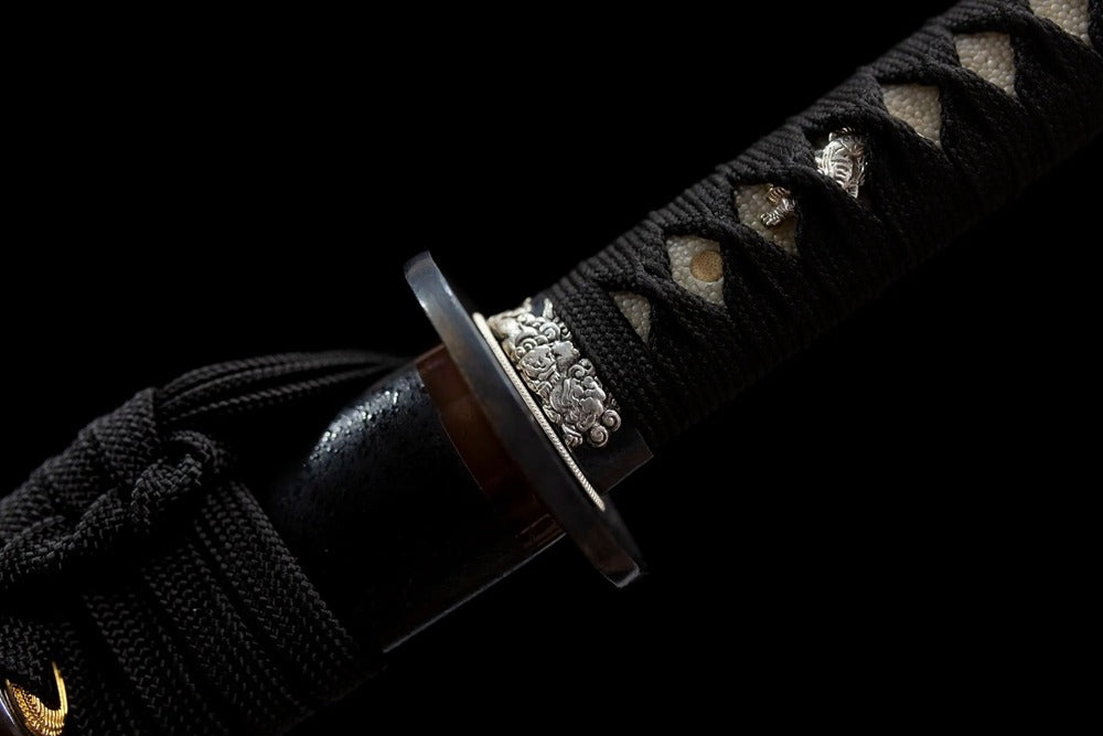 Mixed gold‑silver copper‑alloy lion‑relief fuchi grip‑ring macro close‑up