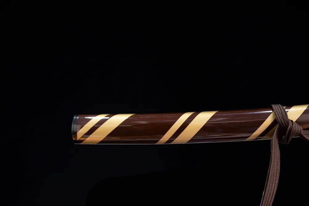 Bottom half‑split dual‑toned saya two‑tone‑plated kojiri end‑cap close‑up