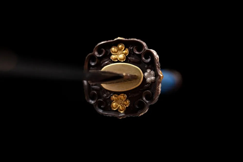 Front open‑work floral‑family‑mon gold‑silver‑plated copper tachi hand‑guard close‑up