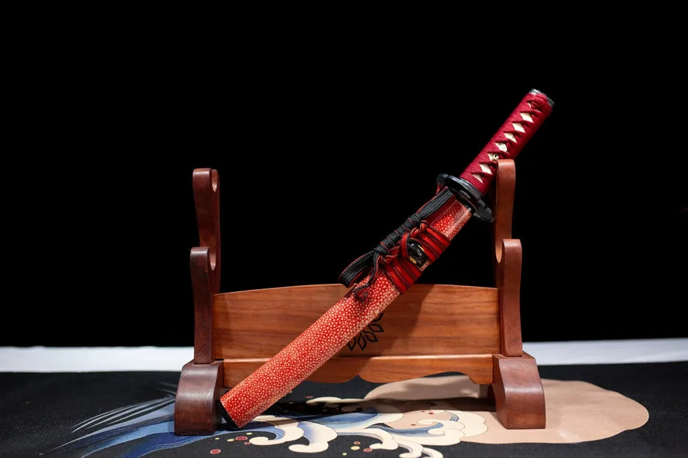 45° front fully sheathed Red‑Plum‑Wakizashi oriental plum‑blossom‑art wakizashi placed on carved wooden sword display stand
