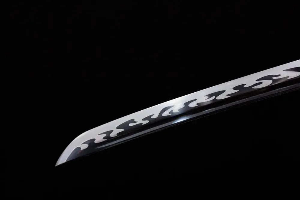 Classic functional katana‑style kissaki tip of Hell‑Katana blade close‑up view