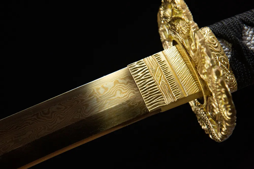Upper blade closeup bright red flame notare hamon near red plated copper habaki