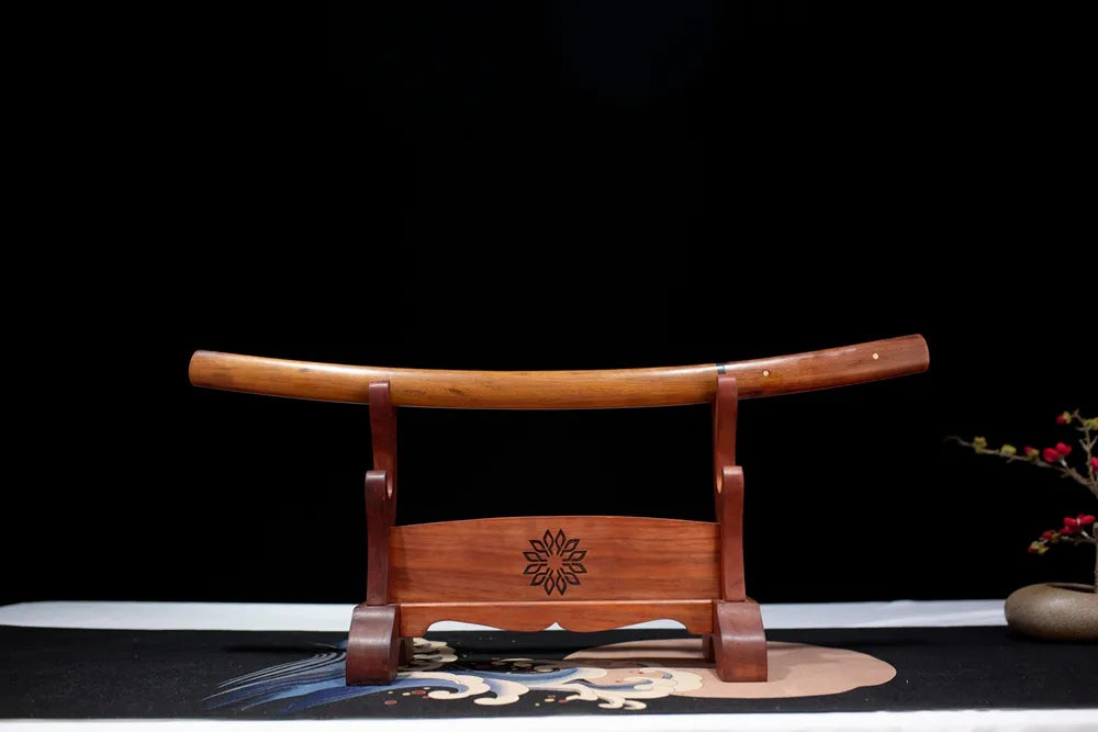 Horizontal laid closed natural bare‑wood unpainted Jihad‑Shirasaya‑Wakizashi scabbard flat table‑top front display
