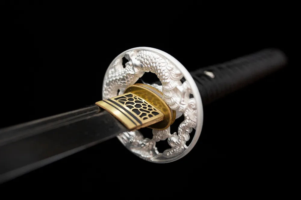 Front open‑work nocturnal‑butterfly‑silhouette‑relief matte‑black‑alloy katana hand‑guard close‑up
