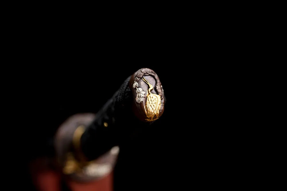 3D‑sculpted tsurumaru‑crane antique‑brass pommel‑cap detail shot