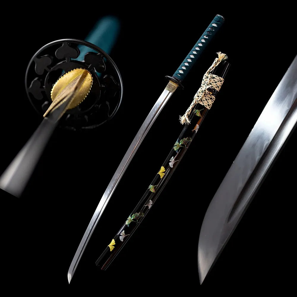 Ginkgo‑leaf traditional collectible katana drawn polished blade ivory ginkgo‑print saya full black‑background studio shot