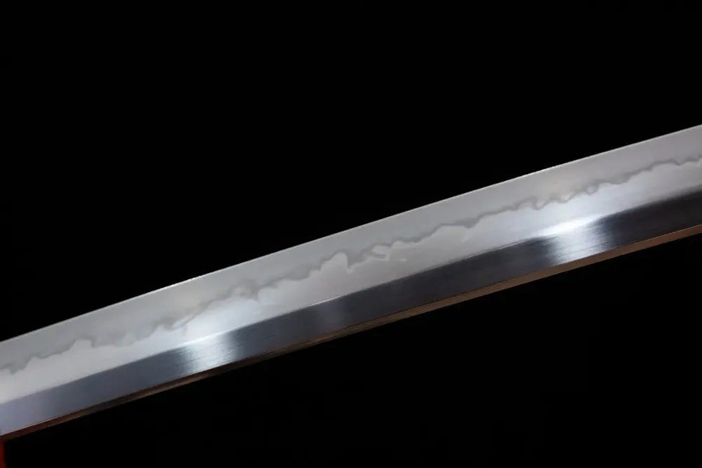 Mid‑section midare‑gunome layered‑maple‑undulating‑pattern hamon steel katana blade surface close‑up shot