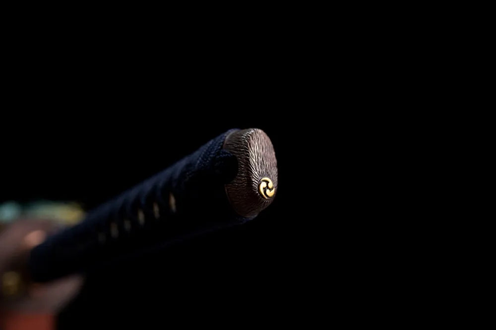 Cosmic‑star‑engraved brass‑alloy pommel‑cap detail shot