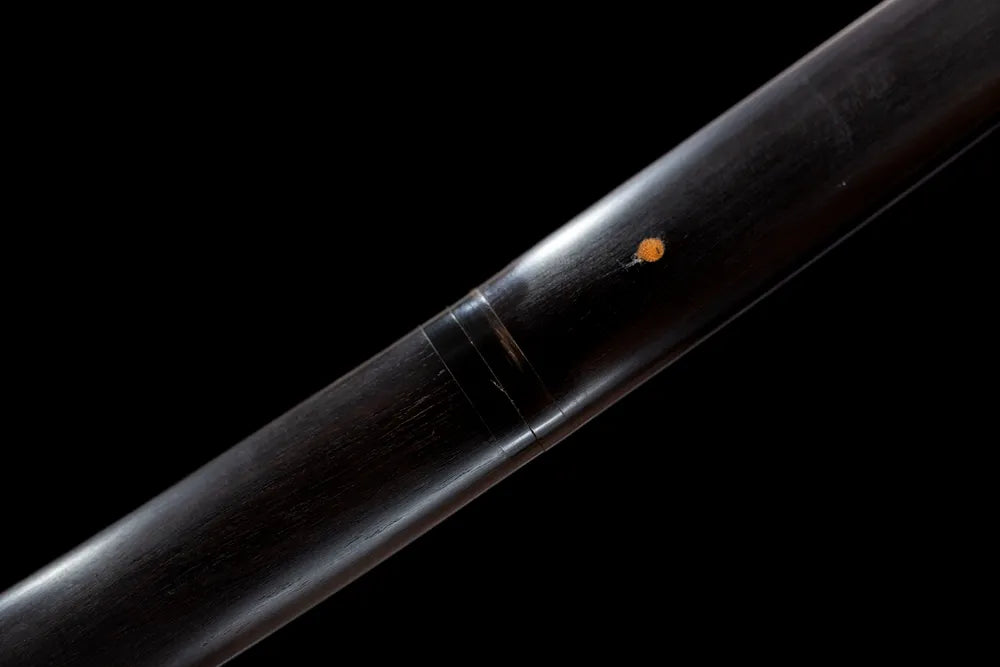 Plain un‑ornamented brass fuchi grip‑ring macro close‑up