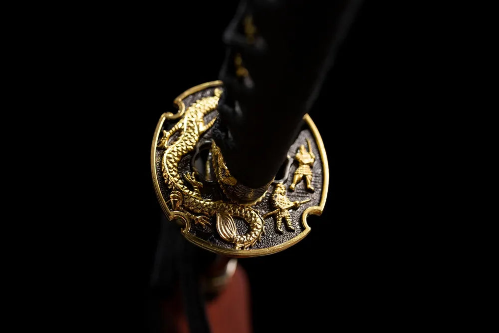 Reverse‑side dragon‑warrior carving gilded‑alloy tsuba surface texture close‑up