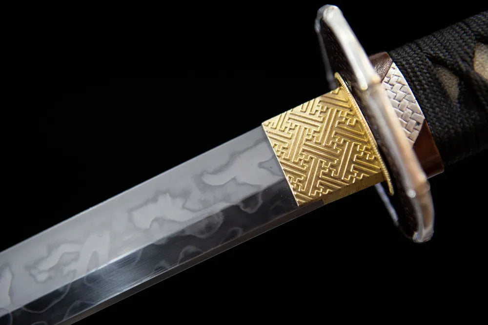 Upper choji hamon blade & golden bamboo habaki close-up