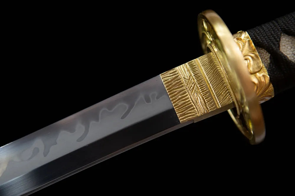 Upper choji wave hamon blade & gold habaki close-up