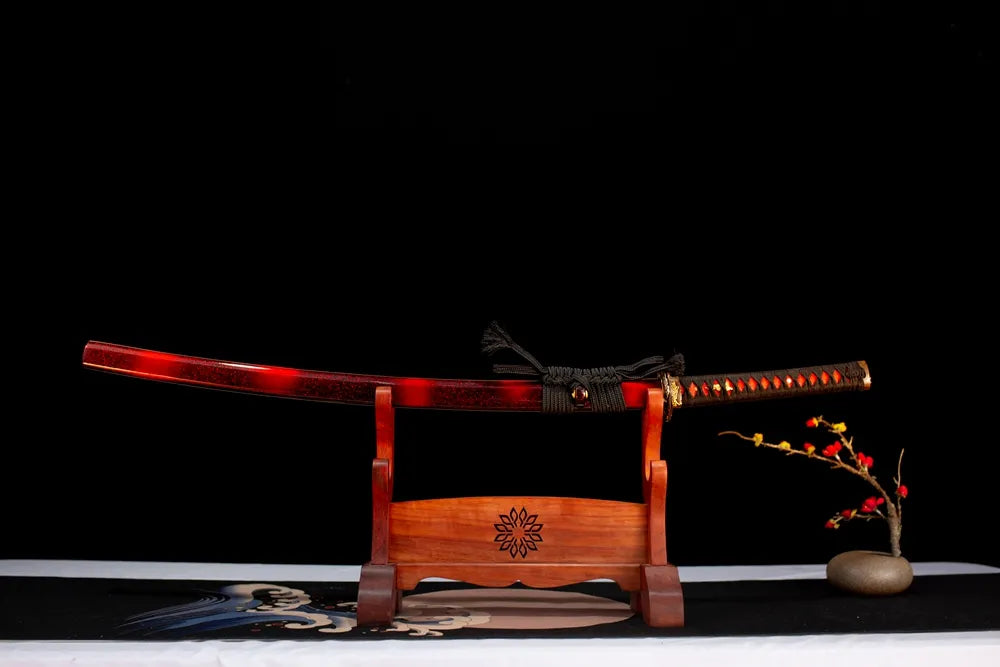 Horizontal laid closed wine‑red‑gradient glitter‑maki‑e Supreme‑Katana scabbard flat table‑top front display