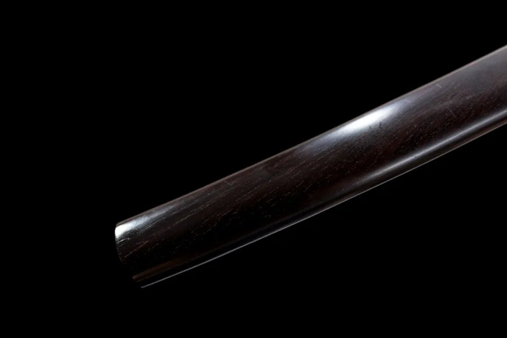 Bottom plain black shirasaya saya smooth wood end‑cap close‑up
