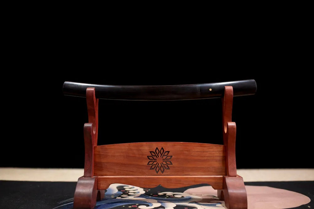 Horizontal laid closed light‑gray silver‑feather‑print Wing‑Wakizashi scabbard flat table‑top front display