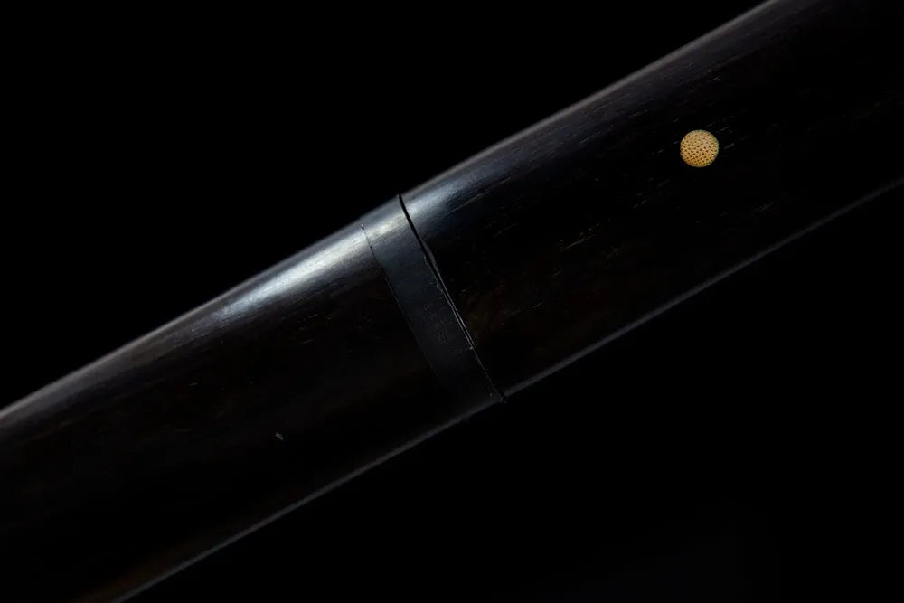 Mid carved black wood sheath texture