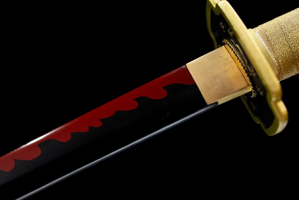 Upper red‑flame‑print 1060 steel blade golden alloy habaki macro close‑up with kanji mark
