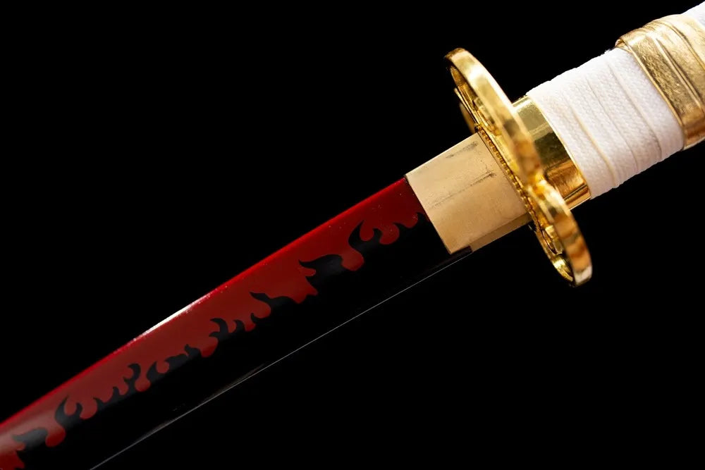 Upper 1060 steel red flame pattern blade gold‑plated habaki macro close‑up