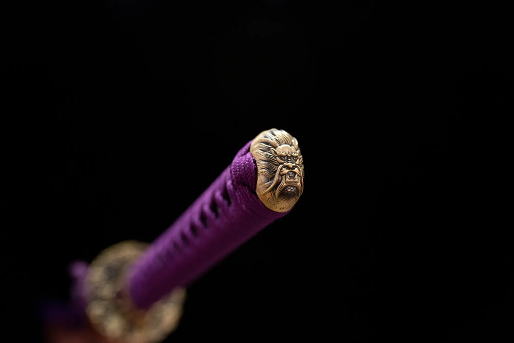 3D‑sculpted wisteria‑scroll purple‑toned purple‑gild pommel‑cap detail shot