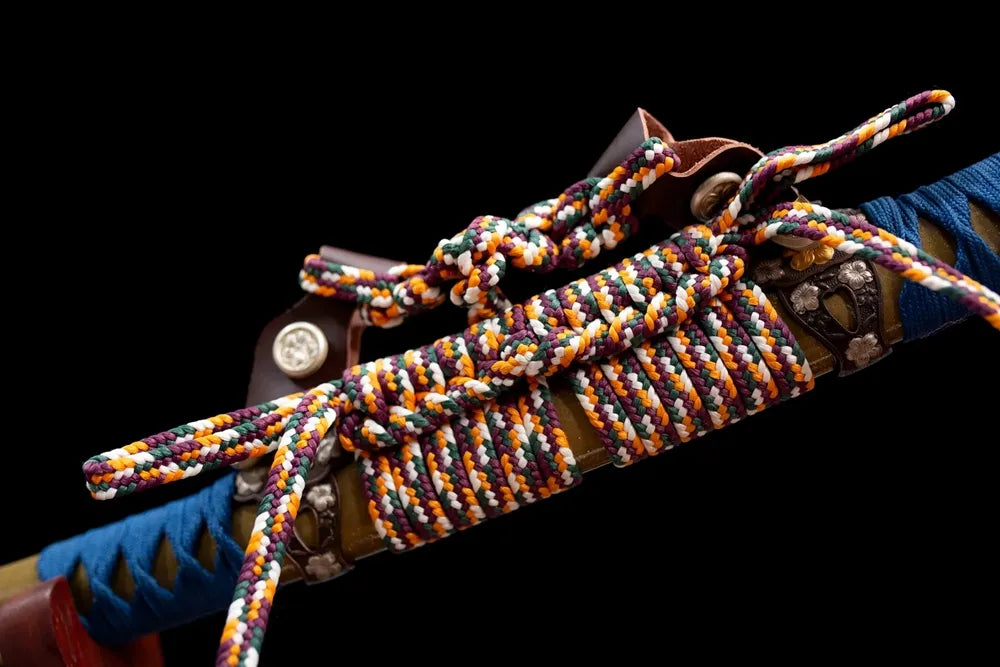 Multicolor woven thick tachi‑no‑sageo cord gold‑silver‑plated copper fitting macro close‑up