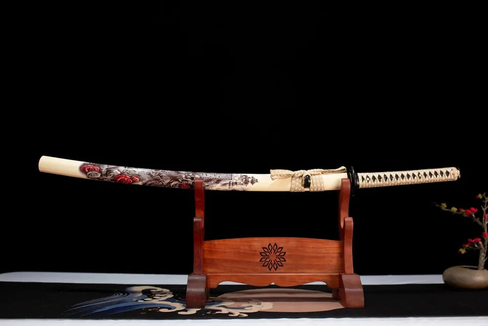 Horizontal laid closed cream‑white warrior‑dragon‑rose‑illustrated Dragon‑Warrior‑Katana scabbard flat table‑top front display